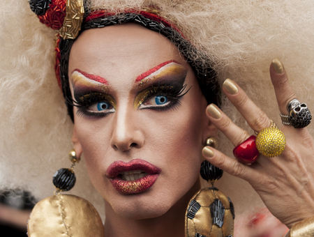 BERLIN, GERMANY - JUNE 21, 2014: Christopher Street Day. Crowd of people Participate in the parade celebrates gays, lesbians, bisexuals and transgenders. Prominent in the image, elaborately dressed transgenderのeditorial素材