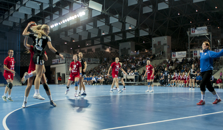 SZCZECIN, POLAND - JUNE 21, 2014: Patrycja Krolikowska of Pogon, shoots a goal during Handball Womenのeditorial素材