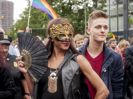 BERLIN, GERMANY - JUNE 21, 2014:Christopher Street Day.Crowd of people Participate in the parade celebrates gays, lesbians, and trans-genders. Prominent in the image, elaborately dressed participants.のeditorial素材
