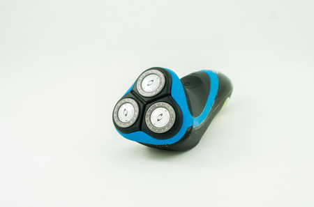 Electric shaver over white background