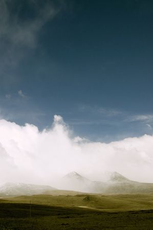 Landscape with mountains and storm cloudsの写真素材
