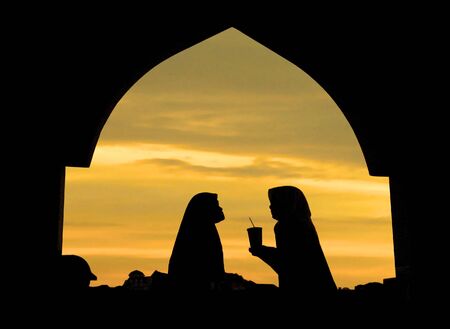 islamic woman infront a mosqueの写真素材