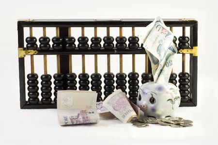Financial concept photo with abacus and piggy bankの写真素材
