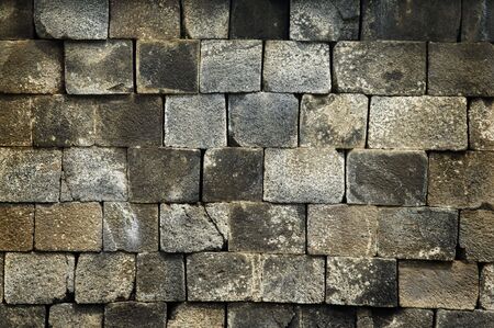 Old stone wall, flat stacked background and texture.の写真素材