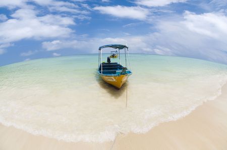 Taxi boat on a tropical beach, Pulau Perhentian, Malaysia.