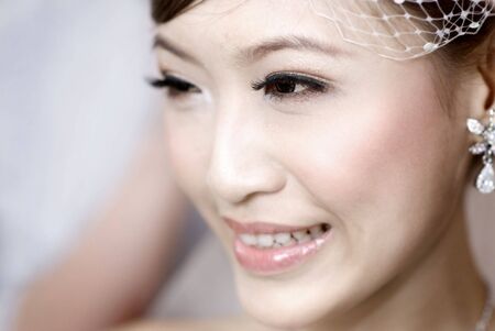 Beautiful young Asian bride smiling.の写真素材