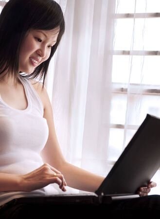 Happy Asian women using internet.の写真素材