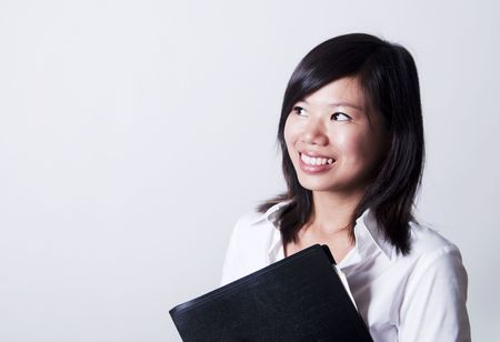 Young Asian woman looking to bright side.の写真素材