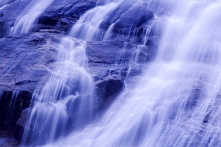 Waterfall in japanese garden, blue tone.の写真素材