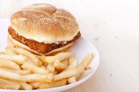 Fish burger and  Fries on plateの写真素材