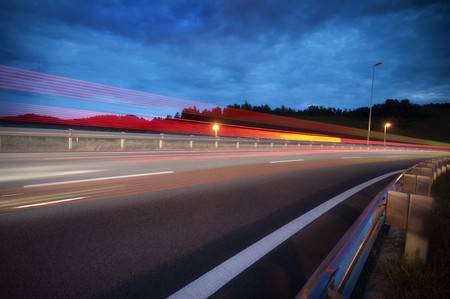 Fast car passing by highway, slow shutterの写真素材