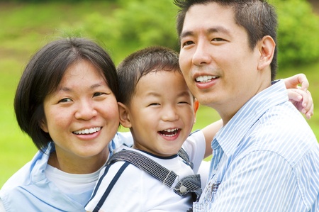 Happy Asian family at outdoorsの写真素材