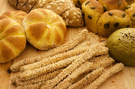 Variety of Organic Breads on plank backgroundの写真素材