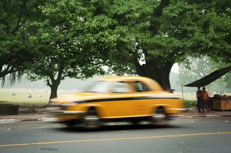 Motion blurred of old taxi in Calcutta (Kolkata), West Bengal, India.の写真素材