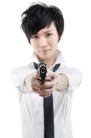 Cool Asian bodyguard holding a gunの写真素材