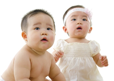 Asian baby boy and baby isolated on whiteの写真素材