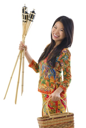 Happy young Malay woman ready to celebrate Hari Raya Aidilfitri / Eid ul-Fitrの写真素材