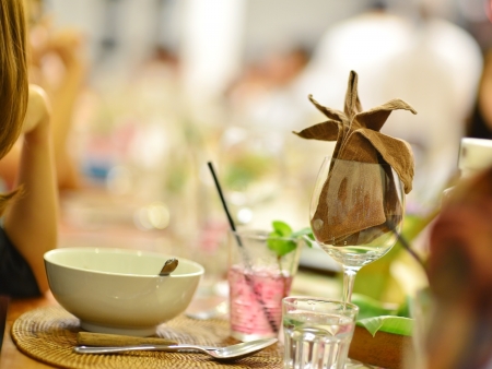 Group of people having reunion party, focus on the wineglassの写真素材