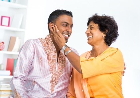 Happy mature Indian woman with her adult sonの写真素材