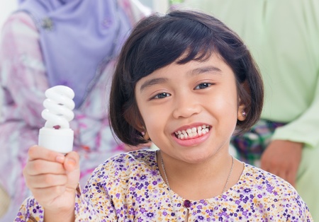 Muslim Southeast Asian girl lightbulb idea concept.の写真素材