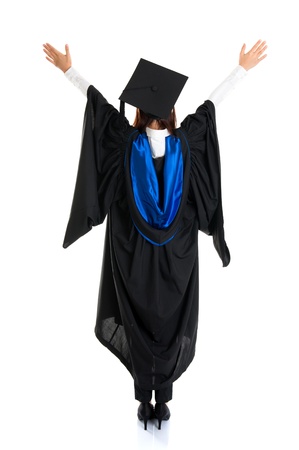 Full body rear view happy Asian female student in graduation gown raised hands open arms standing isolated on white backgroundの写真素材