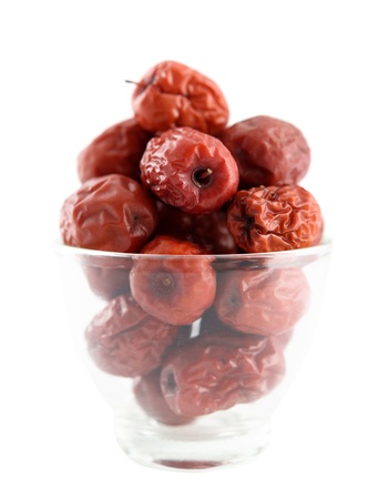 Dried red date or Chinese jujube. Traditional herbal medicine isolated on white background.の写真素材