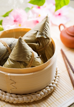 Hot rice dumpling or zongzi. Traditional steamed sticky  glutinous rice dumplings. Chinese food dim sum. Asian cuisine.の写真素材
