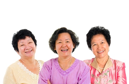 Three Asian senior women smiling happily isolated on white background.の写真素材