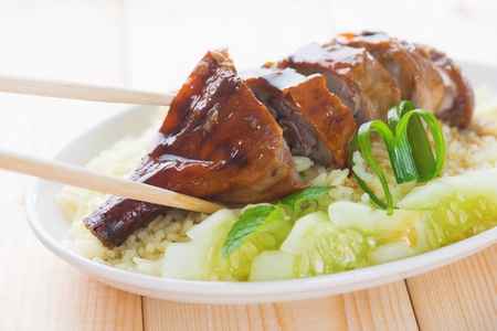 Roasted duck, Chinese style, served with steamed rice on dining table. Malaysia cuisine.の写真素材