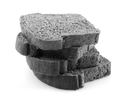 Stacks of organic black charcoal bread isolated on white backgroundの写真素材