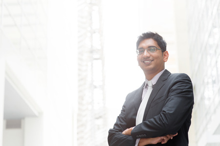 Portrait of happy and confident Asian Indian businessman smiling