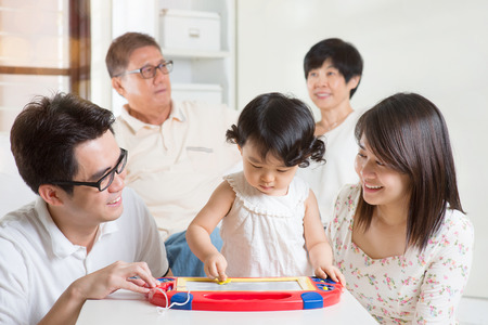 Happy family portrait. Asian multi generations having fun at home.の写真素材