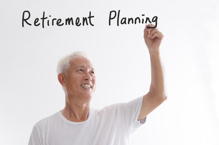 Portrait of old Asian man hand writing, retirement planning concept, isolated on white background.の写真素材