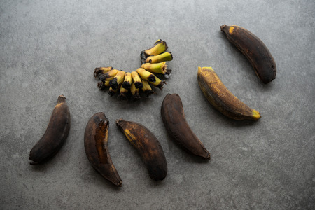 Rotten bananas on grey background.の写真素材