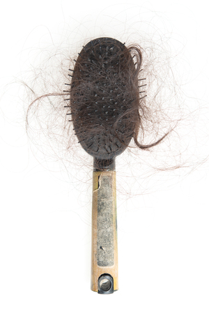 Flat lay used dirty hairbrush with lost hair on it, isolated on white background.の写真素材
