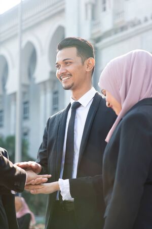 Multiracial business people stacking hands, businessman and businesswoman teamwork concept.の写真素材