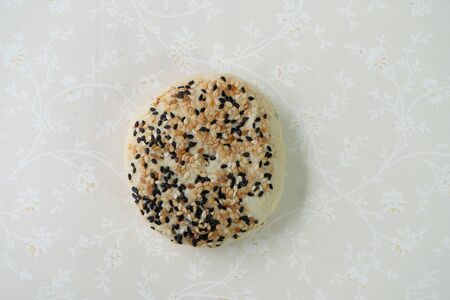 Chinese moon cake or pastry with sesame on top.