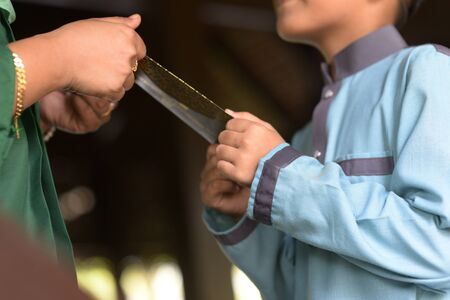 Muslim family greeting, Hari Raya Eid Al-Fitr concept.の写真素材