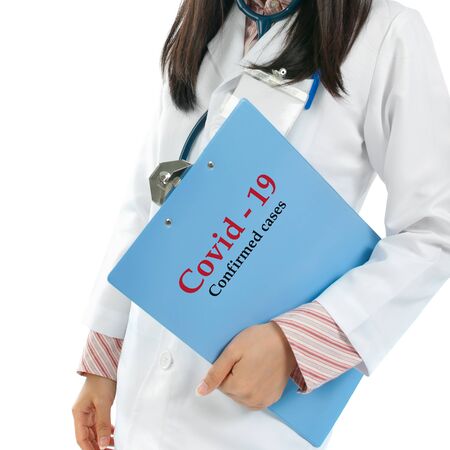 Medical doctor with Coronavirus Covid 19 report confirmed cases file.の写真素材