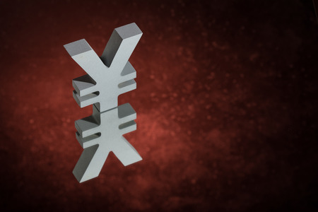 Japanese of Chinese Currency Symbol Yen or Yuan With Mirror Reflection on Red Dusty Backgroundの写真素材