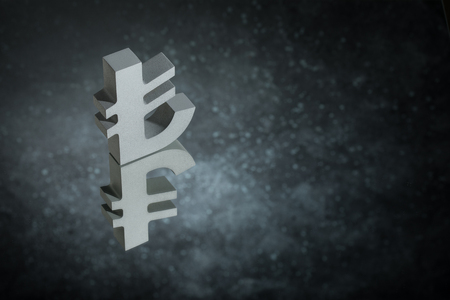 Turkish Currency Symbol or Sign Lira With Mirror Reflection on Dark Dusty Backgroundの写真素材