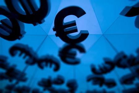 Euro Currency Symbol With Many Mirroring Images of Itself on Blue Backgroundの写真素材