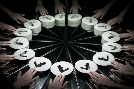 Hands Reaching for Litecoin Crypto Currency Symbol on Mirror Covered In Smoke With many Reflections of Itselfの写真素材