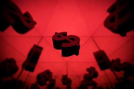 Dollar Currency Symbol With Many Mirroring Images of Itself on Red Backgroundの写真素材