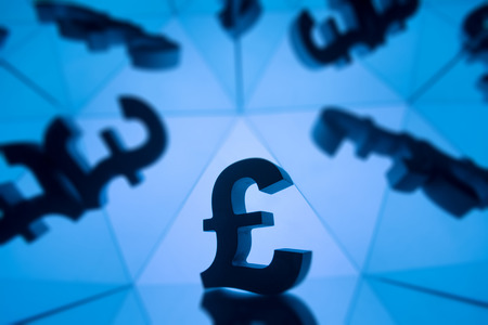 British Pound Sterling Currency Symbol With Many Mirroring Images of Itself on Blue Backgroundの写真素材