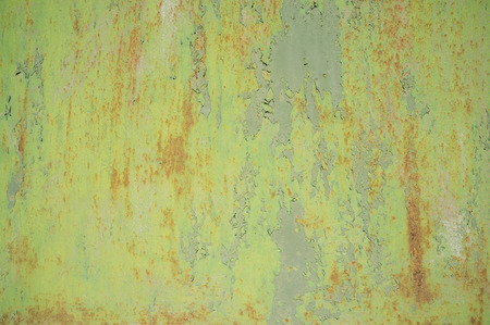 Detail of Old, Grunge, Rusty Metal Doors with Layers of Green, Turquoise and Yellow Paint and Rust.の写真素材
