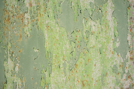 Detail of Old, Grunge, Rusty Metal Doors with Layers of Green, Turquoise and Yellow Paint and Rust.の写真素材