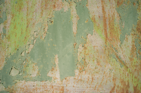 Detail of Old, Grunge, Rusty Metal Doors with Layers of Green, Turquoise and Yellow Paint and Rust.の写真素材
