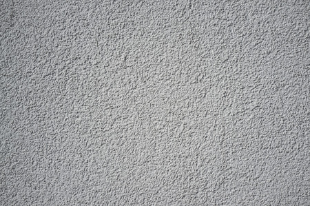 Monochromatic Grainy Texture of Plaster Wall on Bright Sun
