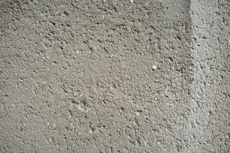 Monochromatic Texture of Old Weathered Concrete Wall with Cracks and Water Stainsの写真素材